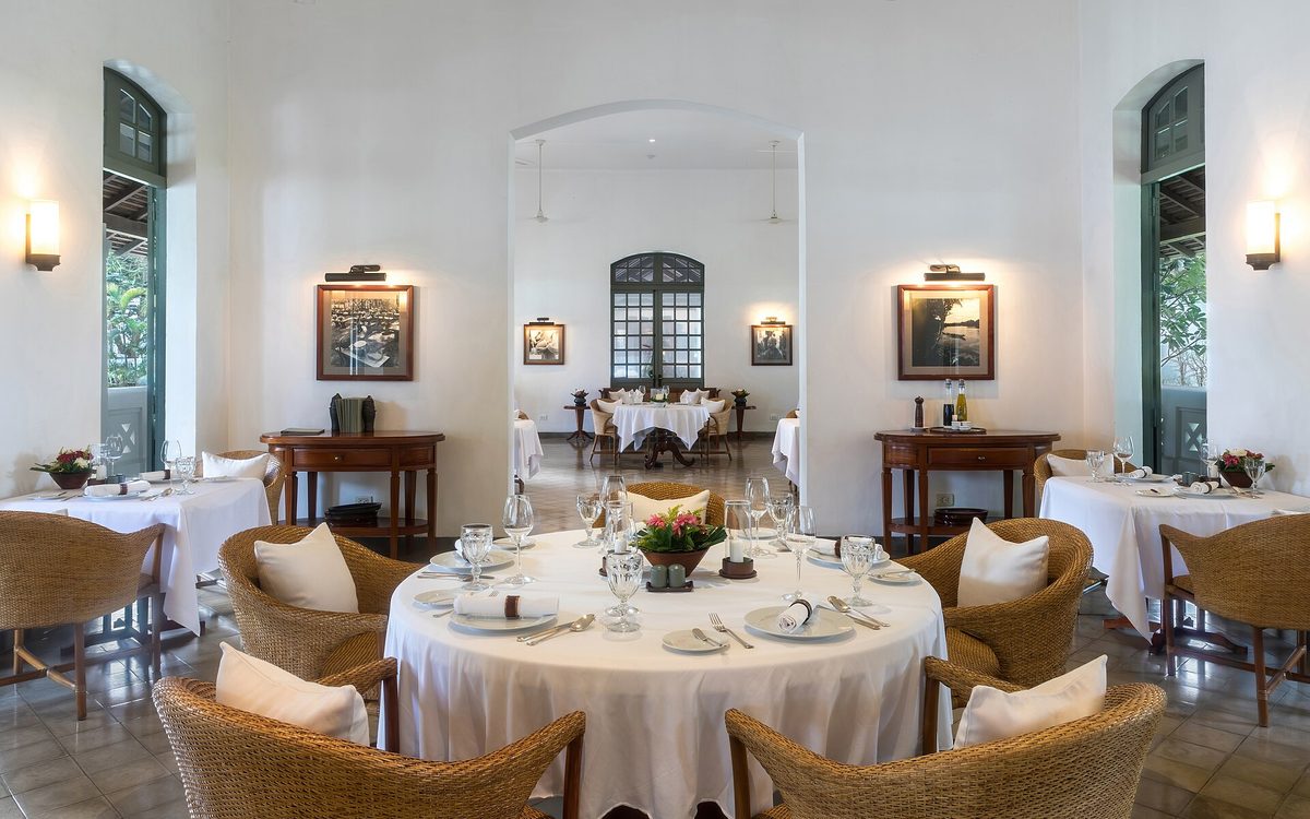 A bright restaurant dining room with set tables